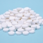 Close-up shot of Wegovy pills on a blue background.