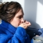 woman taking tablet