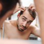 man parting hair