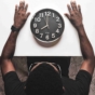 man sitting in front of clock