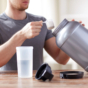 man scooping creatine