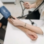 man sat having blood pressure taken