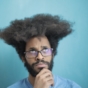 pensive man with afro