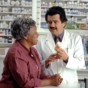 elderly woman speaking to pharmacist