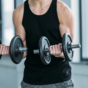 man lifting dumbell weights