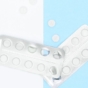 Pills on blue and white background