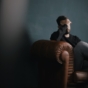 anxious man in armchair