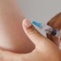 womans arm being injected into