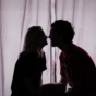 couple kissing in dark