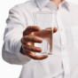 man holding glass of water