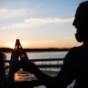 couple enjoying beers on beach