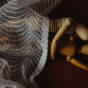 two wooden dolls cuddling