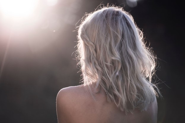 Woman showing off her back after finding out how to get rid of back acne