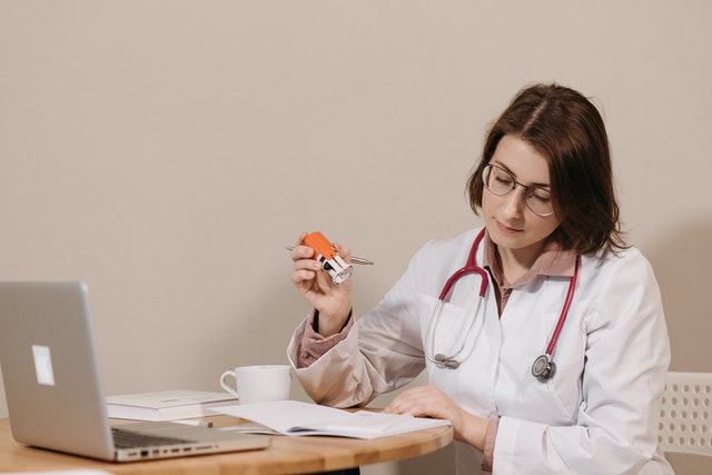 Doctor writing a private prescription