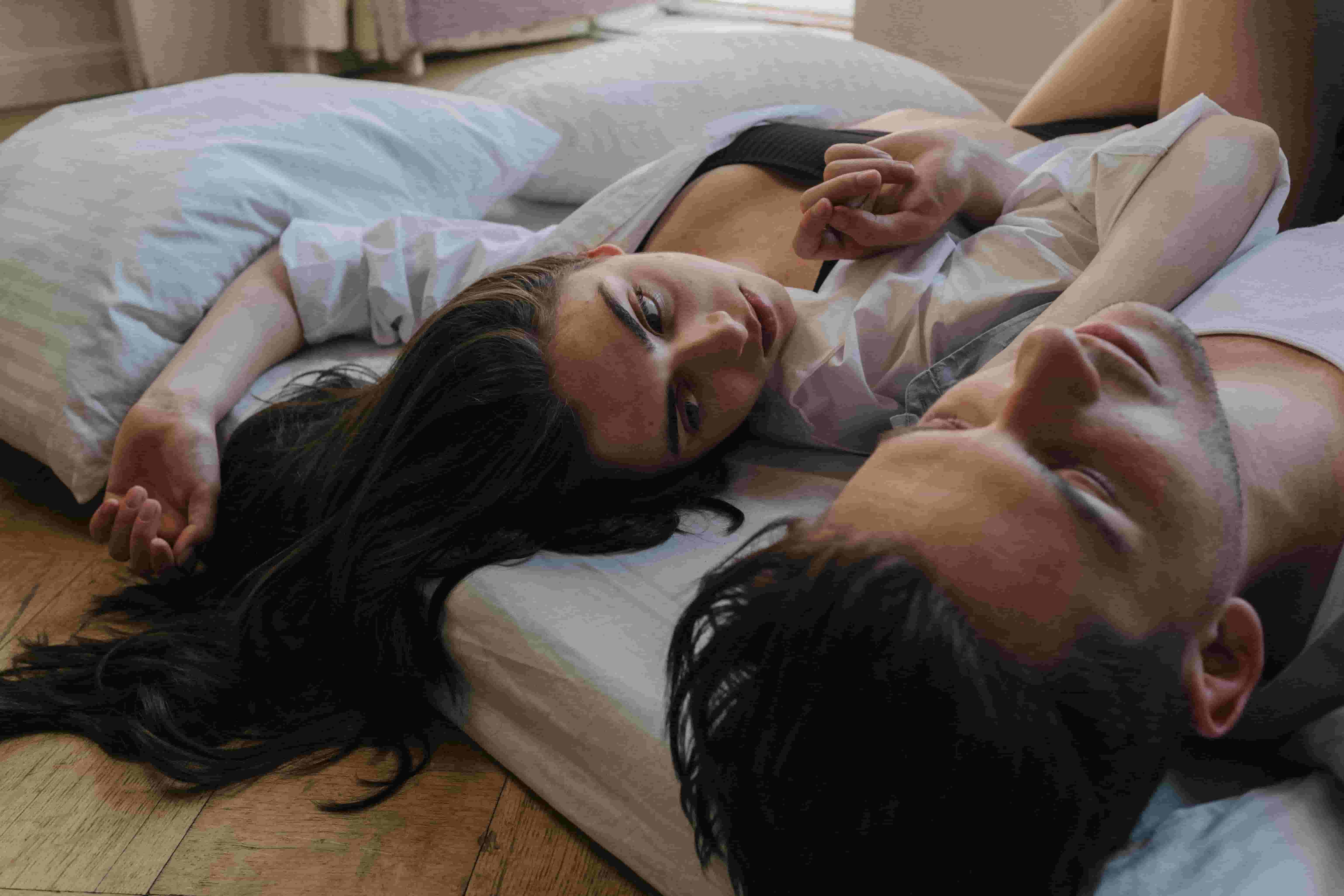 Couple on the edge of a bed