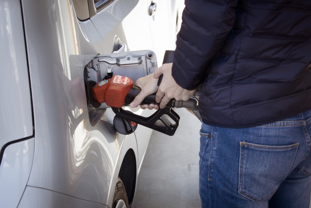 A man pumping petrol