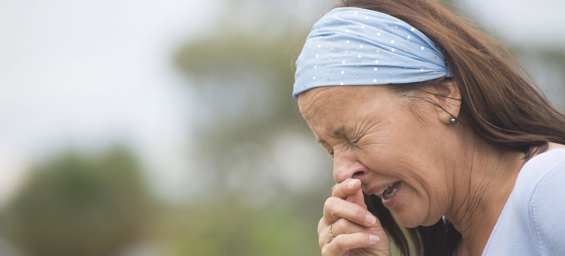 Woman sneezing