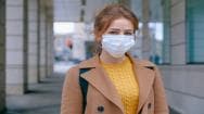 Lady wearing a face mask to protect from viruses such as covid-19